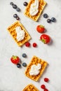 Traditional belgian waffles with whipped cream and fresh fruits Royalty Free Stock Photo