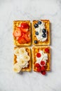 Traditional belgian waffles with whipped cream and fresh fruits Royalty Free Stock Photo