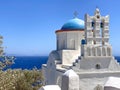 Traditional bells tower and blue dome of the orthodox white churches, Sifnos island, Greece