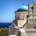 Traditional bells tower and blue dome of the orthodox white churches, Sifnos island, Greece