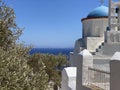 Traditional bells tower and blue dome of the orthodox white churches, Sifnos island, Greece