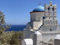 Traditional bells tower and blue dome of the orthodox white churches, Sifnos island, Greece