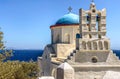 Traditional bells tower and blue dome of the orthodox white churches, Sifnos island, Greece