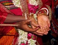 Traditional Bengali Hindu wedding ceremony, groom holding hand in bride hand. Selective focus Royalty Free Stock Photo