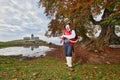 Traditional Bergamo bagpiper of Italian Alps in an autumnal rural context Royalty Free Stock Photo