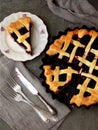 Traditional berries yeast pie tart on rustic wooden background. Homemade sweet cake. Baked pastry food. Top view. Space for text.