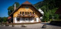 Traditional Black Forest house on the side of the wide road, Hofrat Breitnau, Germany Royalty Free Stock Photo