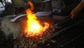 Traditional Blacksmithing: The Process of Forging Metal Over Fire Royalty Free Stock Photo