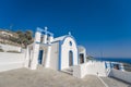 Traditional blue dome church and white bell tower in Santorini in Greece Royalty Free Stock Photo