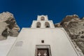 Traditional blue dome church and white bell tower in Santorini in Greece Royalty Free Stock Photo