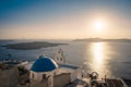 Traditional blue dome church and white bell tower in Santorini in Greece Royalty Free Stock Photo