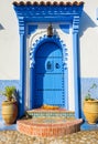 Traditional blue door in Moroccan city of Chefchaouen vertical Royalty Free Stock Photo