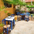 Traditional blue greek chairs and tables