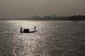 Traditional boat on ganga river in kolkata india in sunset