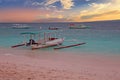 Traditional boat on Gili Meno island beach, Indonesia at sunset