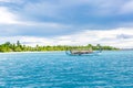 Maldivian dhoni boat in blue ocean background. Maldives traditional wooden boat called Dhoni. Tropical sea and wooden boat Royalty Free Stock Photo