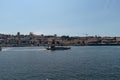 Traditional boat sailing the Douro river in Porto, Portugal Royalty Free Stock Photo