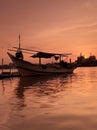 Traditional boat silhouette with sunset background Royalty Free Stock Photo