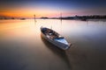 Traditional boat at sunrise in a fishing village Royalty Free Stock Photo