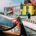 Traditional boats on the canal in Aveiro, Portugal. Colorful Moliceiro boat rides in Aveiro are popular with tourists to Royalty Free Stock Photo