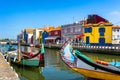 Traditional boats on the canal in Aveiro, Portugal. Colorful Moliceiro boat rides in Aveiro are popular with tourists to enjoy Royalty Free Stock Photo