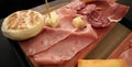 Traditional bolognese tray with typical products: tigelle, crescentine gnocco fritto, mortadella, salami and ham, Parmigiano Reg