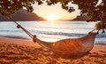 Traditional hammock in the shade at sunset on a calm tropical beach