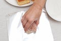 Traditional Brazilian dessert known as BOLO GELADO in Portuguese - Making step by step: Hand putting cake on aluminum foil Royalty Free Stock Photo