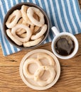 Traditional brazilian polvilho or starch biscuit on a bowl with coffee over wooden table