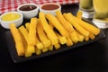 Traditional Brazilian recipe fried polenta in black background