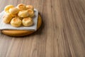 Traditional Brazilian Snack Cheese Bread. On a wooden table background. with copy space