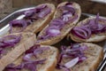 Traditional bread and dripping with purple onion on the top, Hungarian cuisine and gastronomy