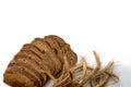 Traditional bread. Fresh loaf of rustic traditional bread with wheat grain ear or spike plant isolated on white background. Rye Royalty Free Stock Photo