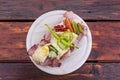 Traditional bread with lots of cold cuts on wooden table on south Styrian vine route Royalty Free Stock Photo