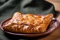 Traditional bread pita or khachapuri on the table with herbs. Homemade baking recipe Royalty Free Stock Photo