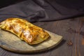 Traditional bread pita or khachapuri on the table with herbs. Homemade baking recipe Royalty Free Stock Photo