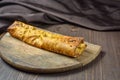 Traditional bread pita or khachapuri on the table with herbs. Homemade baking recipe Royalty Free Stock Photo