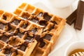 Traditional breakfast: coffee, belgian waffles with honey and chocolate sauce Royalty Free Stock Photo