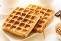 Traditional breakfast: coffee, belgian waffles with honey and chocolate sauce Royalty Free Stock Photo