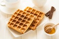 Traditional breakfast: coffee, belgian waffles with honey and chocolate sauce Royalty Free Stock Photo