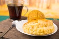 Traditional breakfast of Ecuador, empanada y bolon with coffe