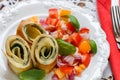 A traditional Breakfast. Omelette with spinach and a fresh tomato salad, red onion and Basil. Roll scrambled eggs Royalty Free Stock Photo