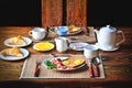 Traditional breakfast set for two persons on the wooden table. Royalty Free Stock Photo