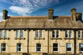 Traditional brick row houses under blue sky with wispy clouds in Harrogate, England Royalty Free Stock Photo