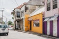 Traditional bright-coloured houses on a street in Speightstown, Barbados.