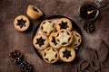 Traditional british christmas Mince pies on a brown plate, sprinkled with sugar. Royalty Free Stock Photo