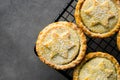 Traditional British Christmas Pastry Home Baked Mince Pies with Apple Raisins Nuts Filling on Cooling Rack. Golden Shortcrust Royalty Free Stock Photo
