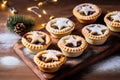 Traditional British Christmas Pastry Home Baked Mince Pies with Apple Raisins Nuts Filling on rustic wood table