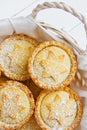 Traditional British Christmas Pastry Home Baked Mince Pies with Apple Raisins Nuts Filling in Wicker Basket. Royalty Free Stock Photo