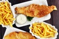 Traditional British fish and chips consisting of fried fish, pot